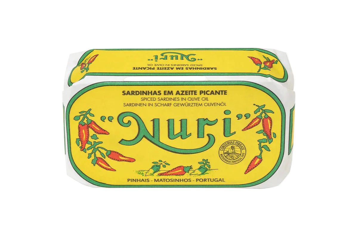 A tin of Nuri Spiced Sardinhas em Azeite Picante (spiced olive oil preserved fish) on a plain white background.